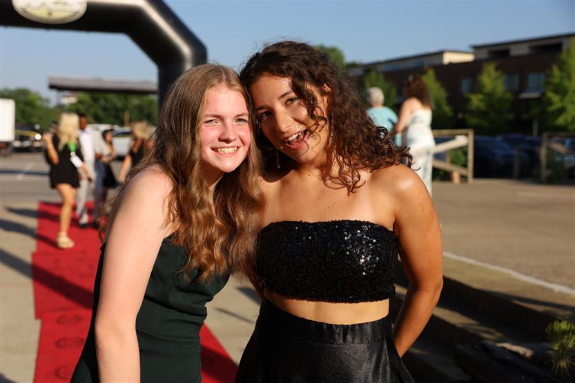 Two student-athletes stand on the red carpet at the WILLCO Awards